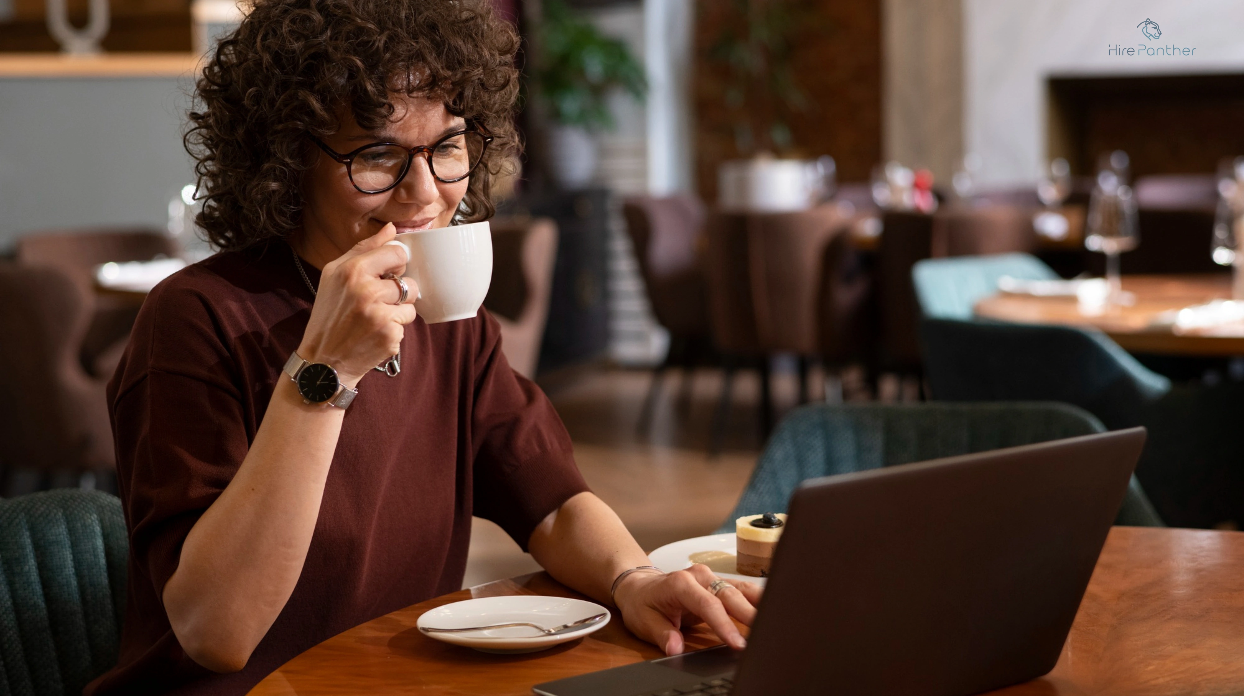Photo of a Gen Z freelancer working from a café or co-working space Gen Z freelancer in café
